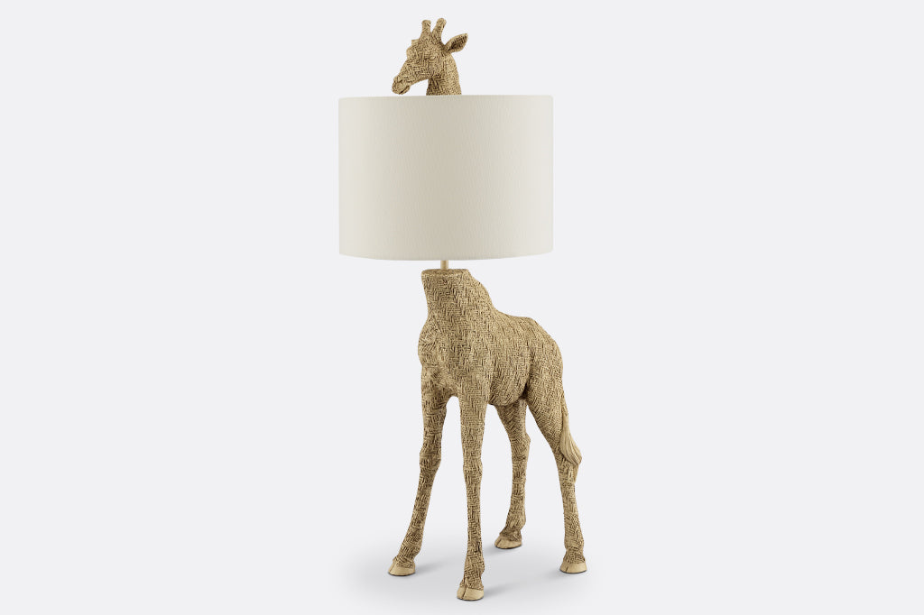 textured golden giraffe lamp with head poking out from top of white fabric shade