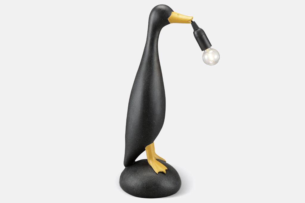 speckled duck shaped lamp with light blub in beak lamp