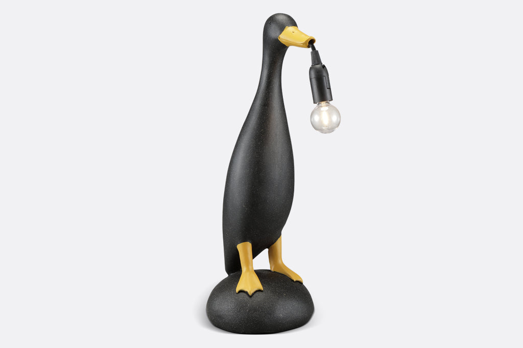 speckled duck shaped lamp with light blub in beak lamp