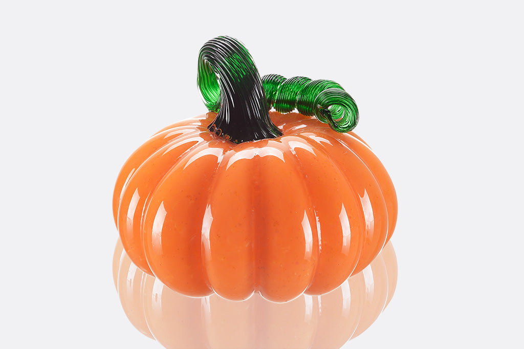 glass pumpkin with curly green stem