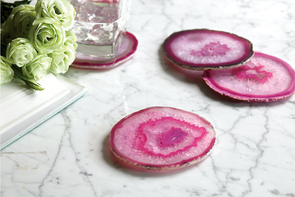 pink crystal coaster in pink with drink placed on top Set of four coasters #color_pink