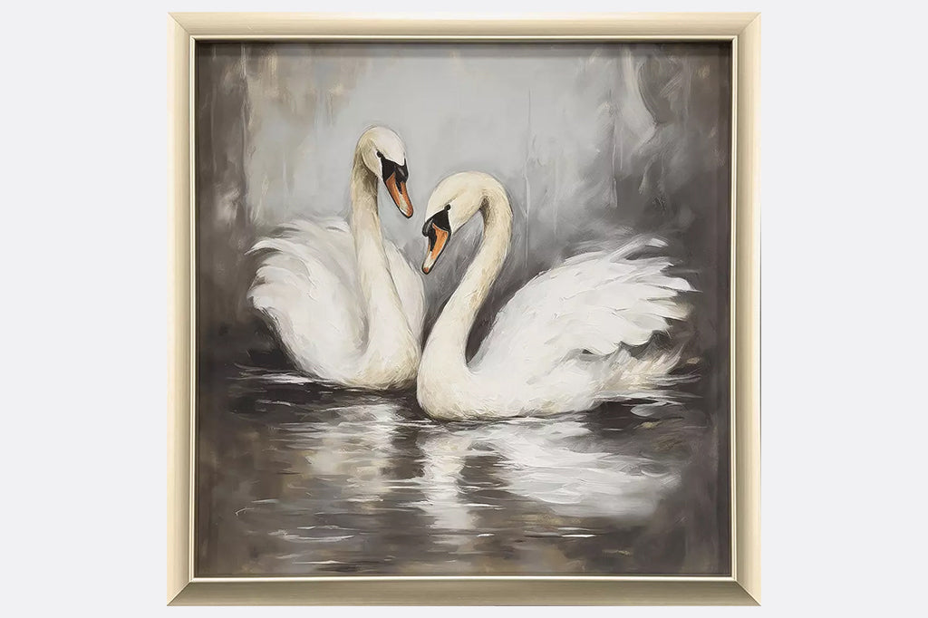 Framed artwork of two swans in water.