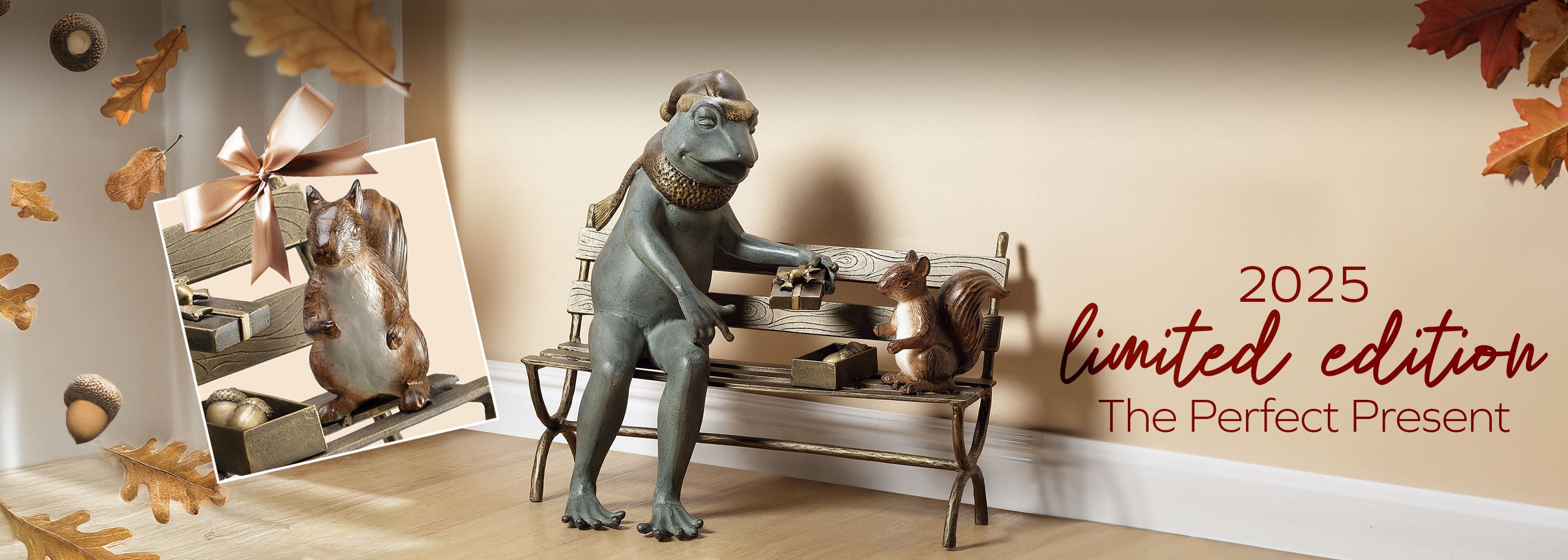 sculpture of frog on a bench with a gift box of nuts and a squirrel - shown in autumn display of scattered nuts and oak leaves