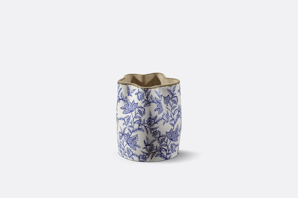 A white vase with blue floral patterns