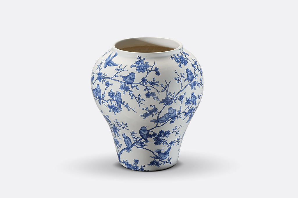 A white and blue Chinoiserie vase with bluebirds and branches