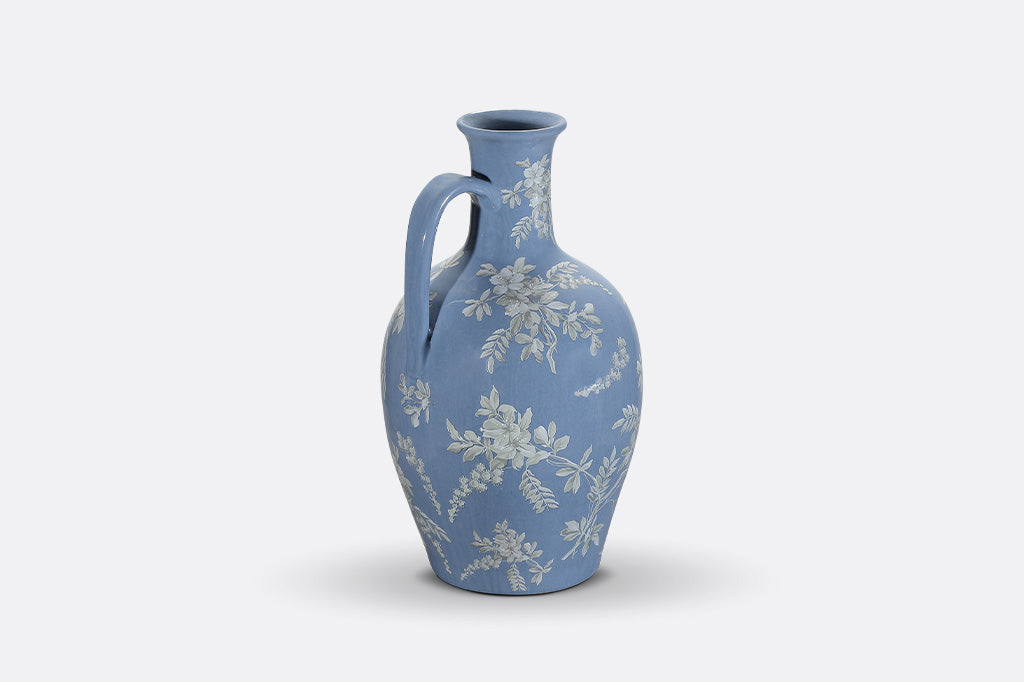 A blue jug ewer a white cornflower design.