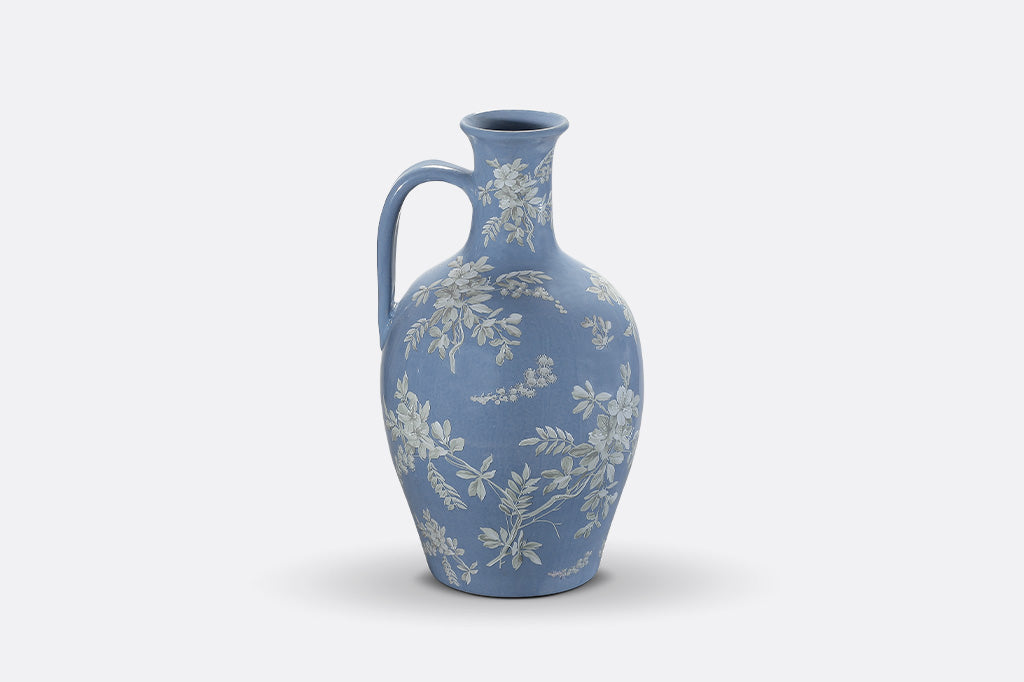 A blue jug ewer a white cornflower design.