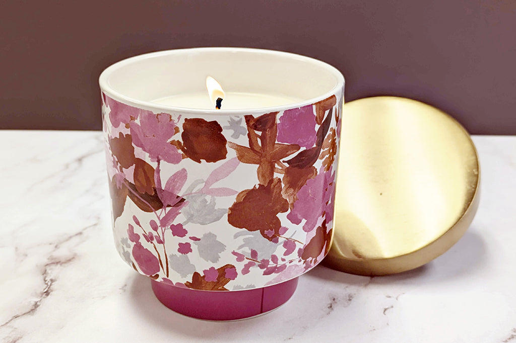 Pink and white floral candle with gold lid single wick