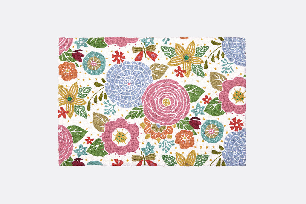 Hooked wool throw rug; scattered floral print in playful shades of pink and blue