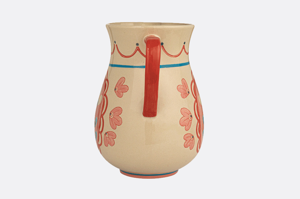 animation of ceramic pitcher, adorned with a French folk art floral design in pretty pinks and blues on a cream background