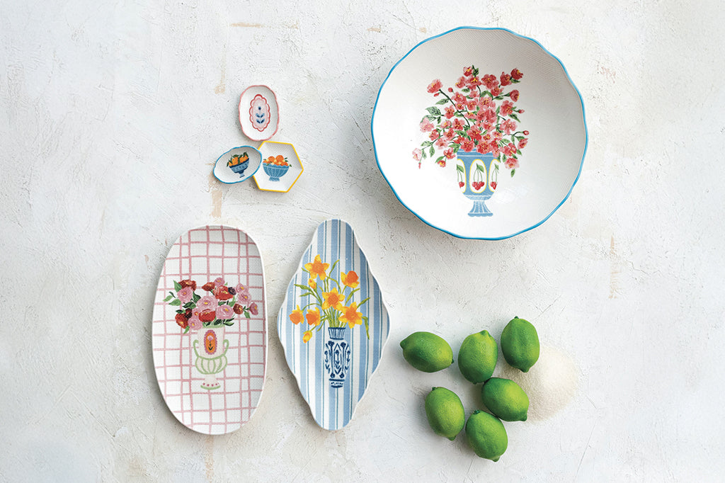 overhead view of serveware, bowls and trays with green limes