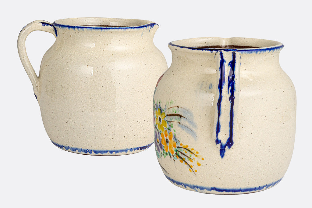 stoneware full size pitcher with glaze painted floral bouquet design. two alt views shown
