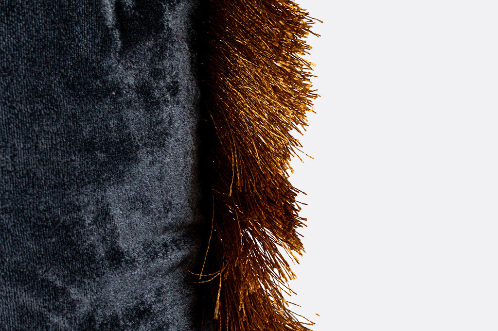 navy velvet pillow, accented with gold fringe