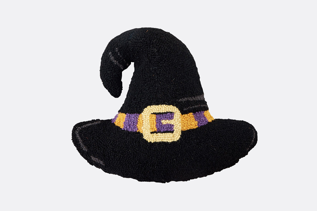 Hooked wool throw pillow shaped like a black witch hat with a gold buckle and purple band