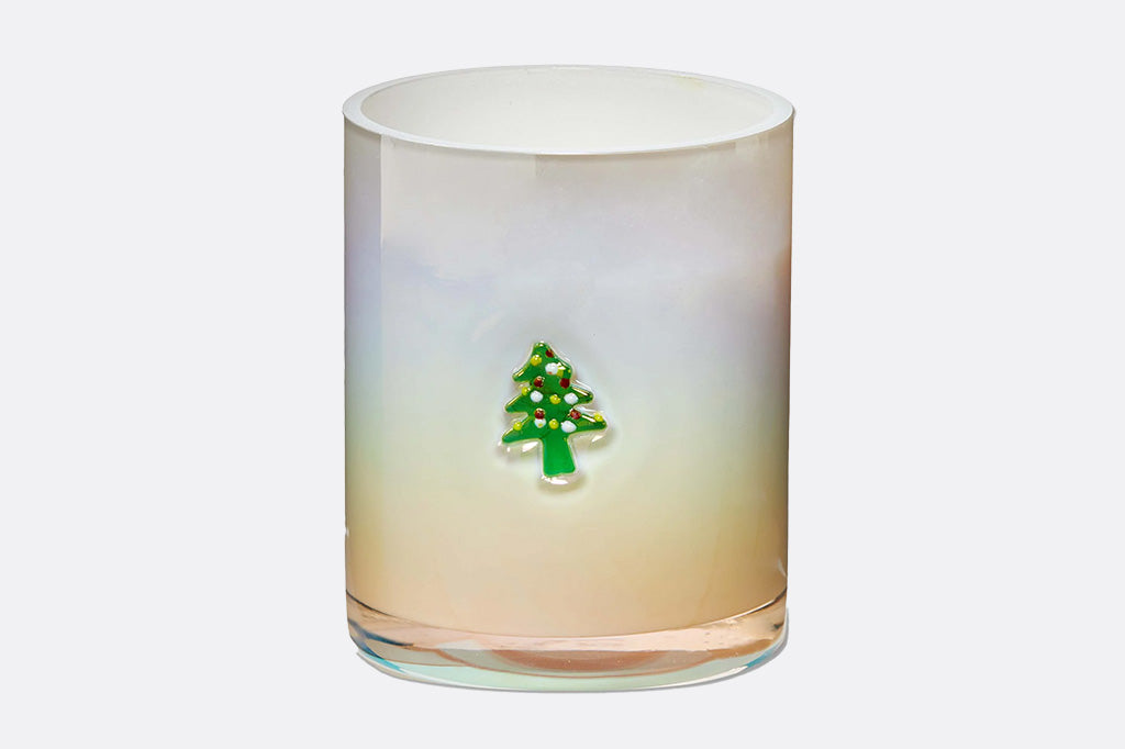Gradient candle with a green tree design on a white background