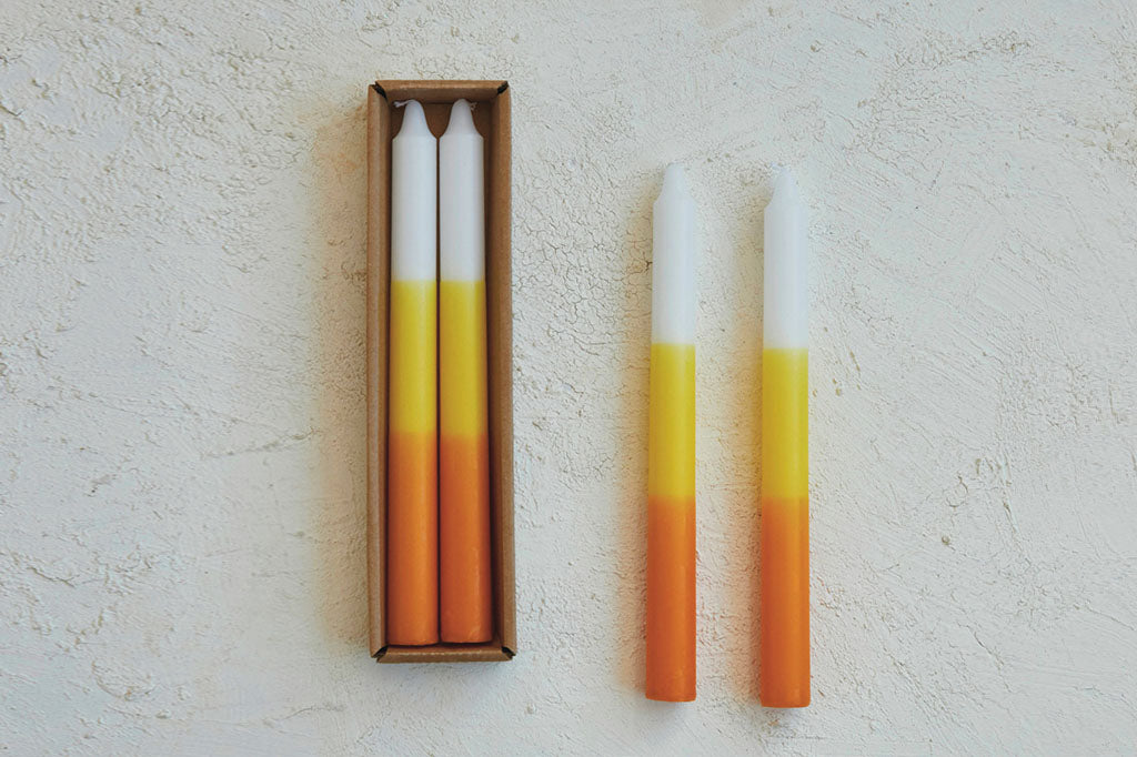 tri-color layers of yellow, orange, and white, these whimsical tapers bring a nostalgic Halloween charm
