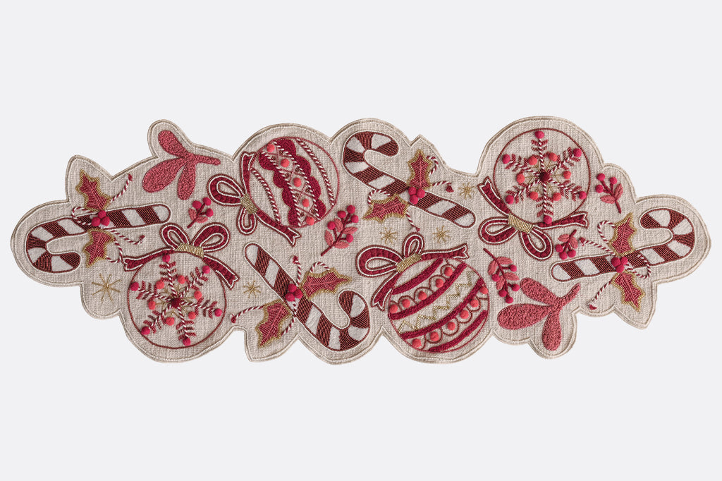 Decorative table runner with candy-themed design on a white background