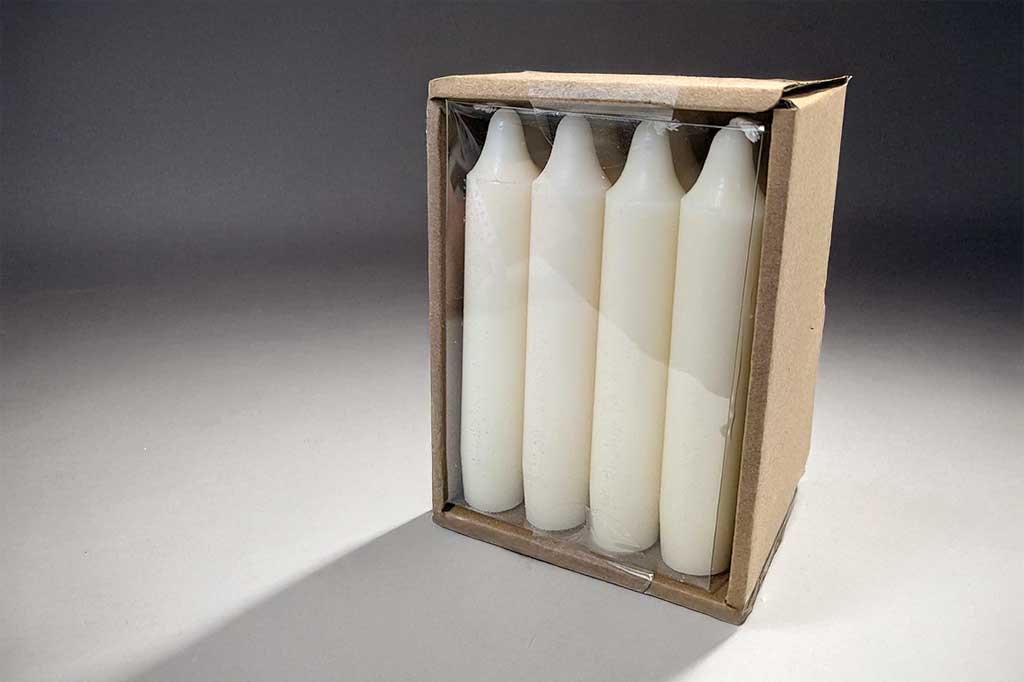 Set of 12 chubby stout white taper candles. Height of candles measures 5 inches. shown in box packaging