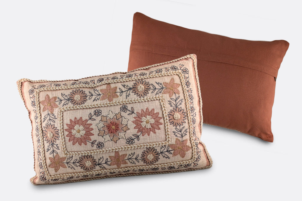 embroidered boho style pillow in creams and russet earth tones, rectangular