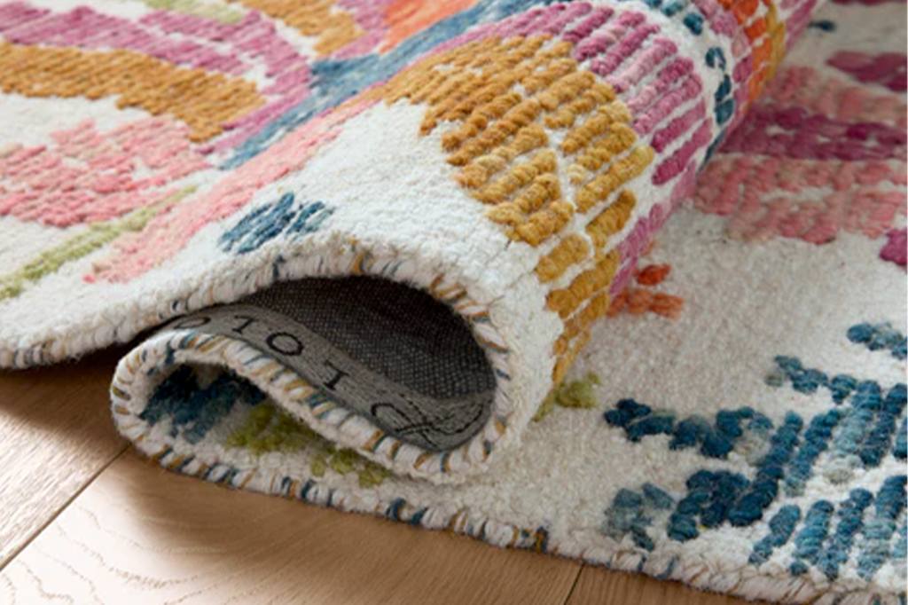 Multicolored patterned rug on a wooden floor
