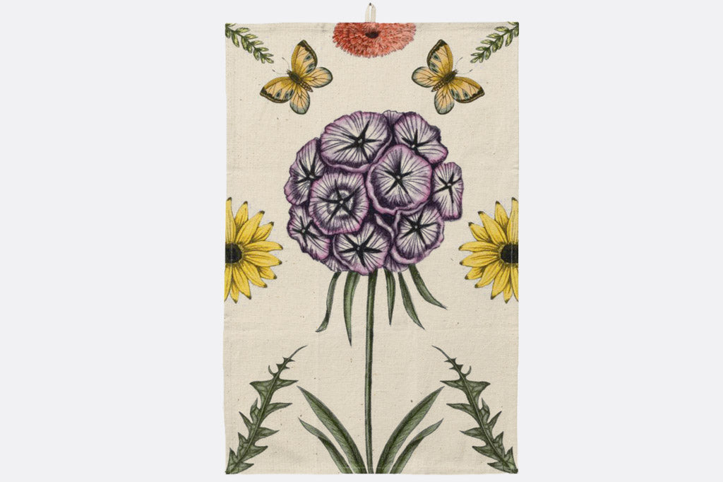 Tea towel with phlox floral and butterfly design on a beige background
