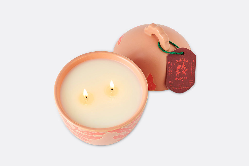A soft orange guava shaped candle.