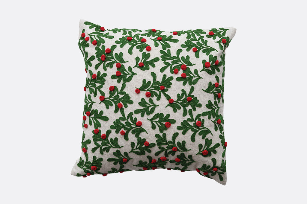 square decorative holiday throw pillow decorated with missletoes