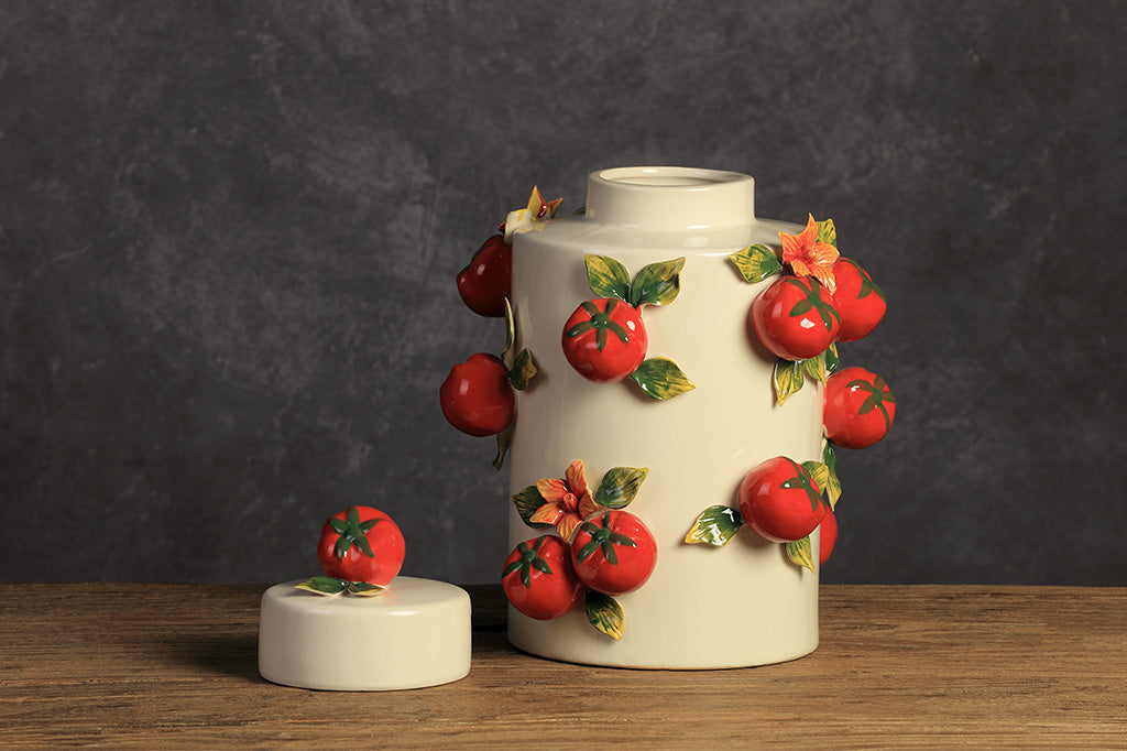 A jar with a tomato design