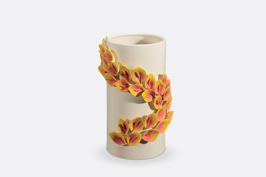 Ceramic vase with floral design on a white background