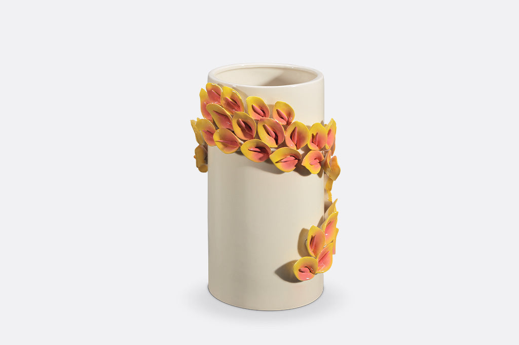 Ceramic vase with floral design on a white background