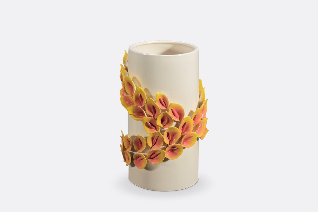 Ceramic vase with floral design on a white background