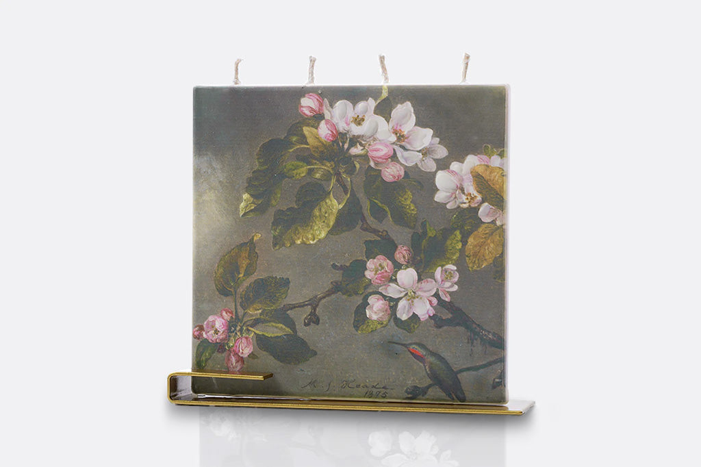 Floral design on a flat square candle with 4 wicks and golden steel holder, shown on a white background