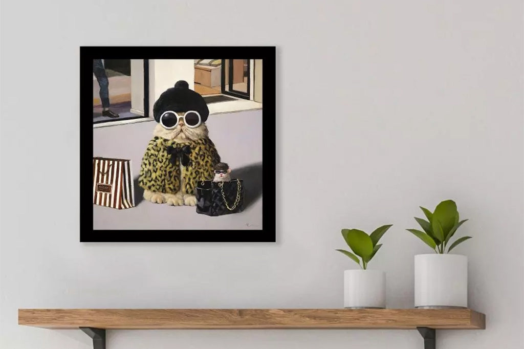 framed art of a posh car in sunglasses and beanie with a black chic purse outside shopping. On living room wall