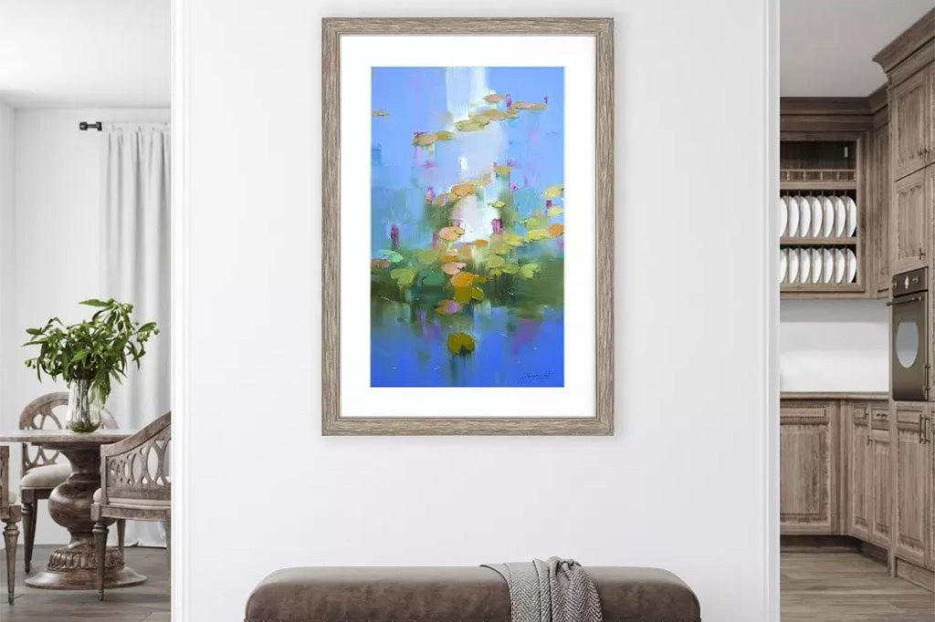 monet style framed art print of water lilies, impressionism. shown on wall above upholstered bench in home hallway