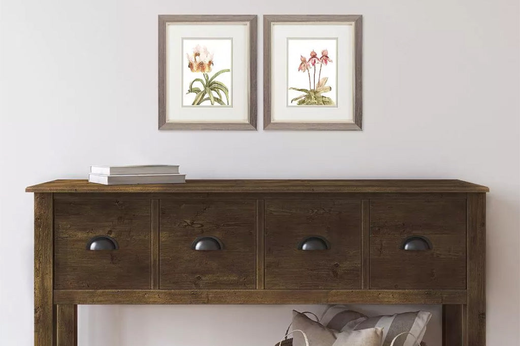 framed art with pink orchids hanging on wall