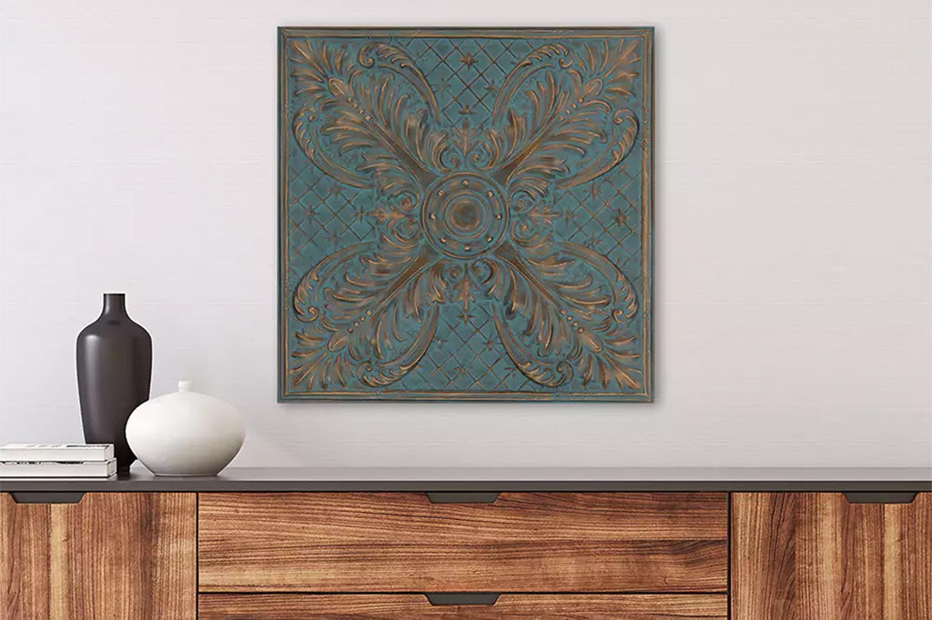 Cast metal wall tile with bronze and blue highlights on wall above wooden cabinet