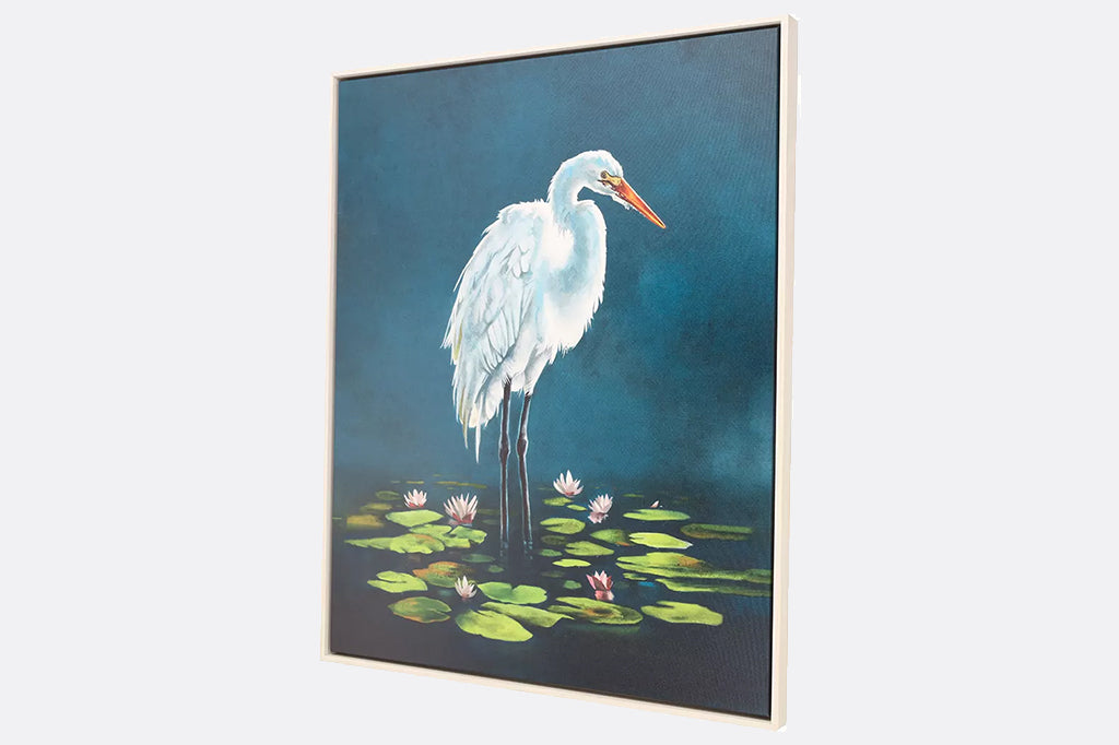 angled view of white egret in lily pond blue background, see texture of the art piece.