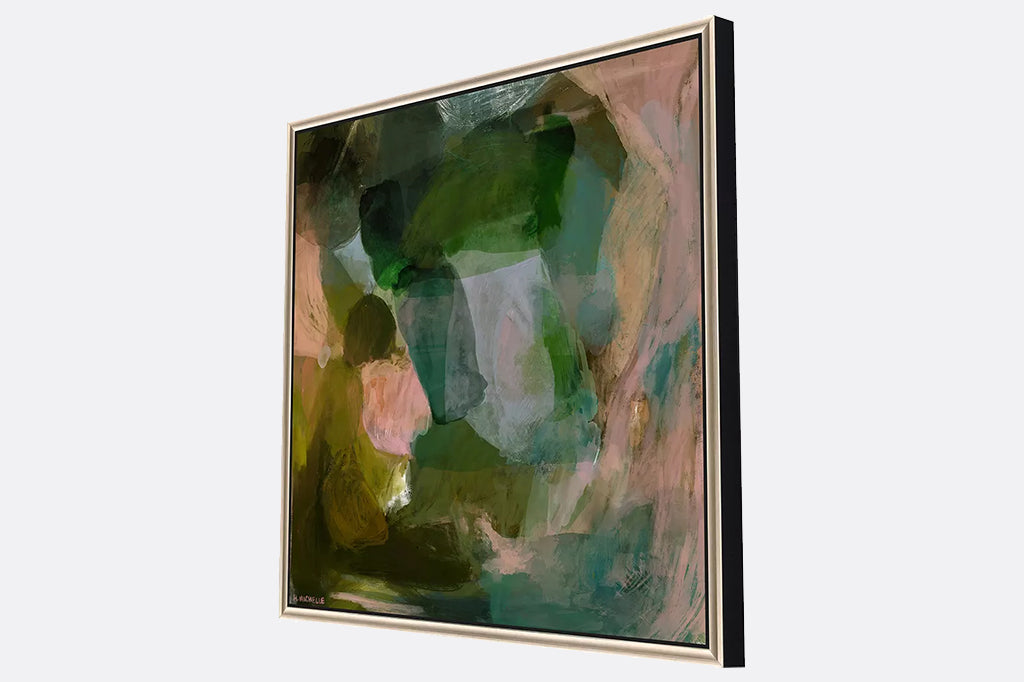 Side angle view of framed artwork, abstract shades of green and pink