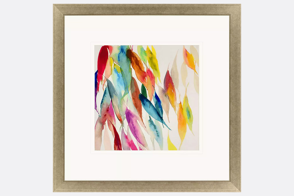 Printed art of colorful falling leaves, double matted in white and framed in champagne gold frame