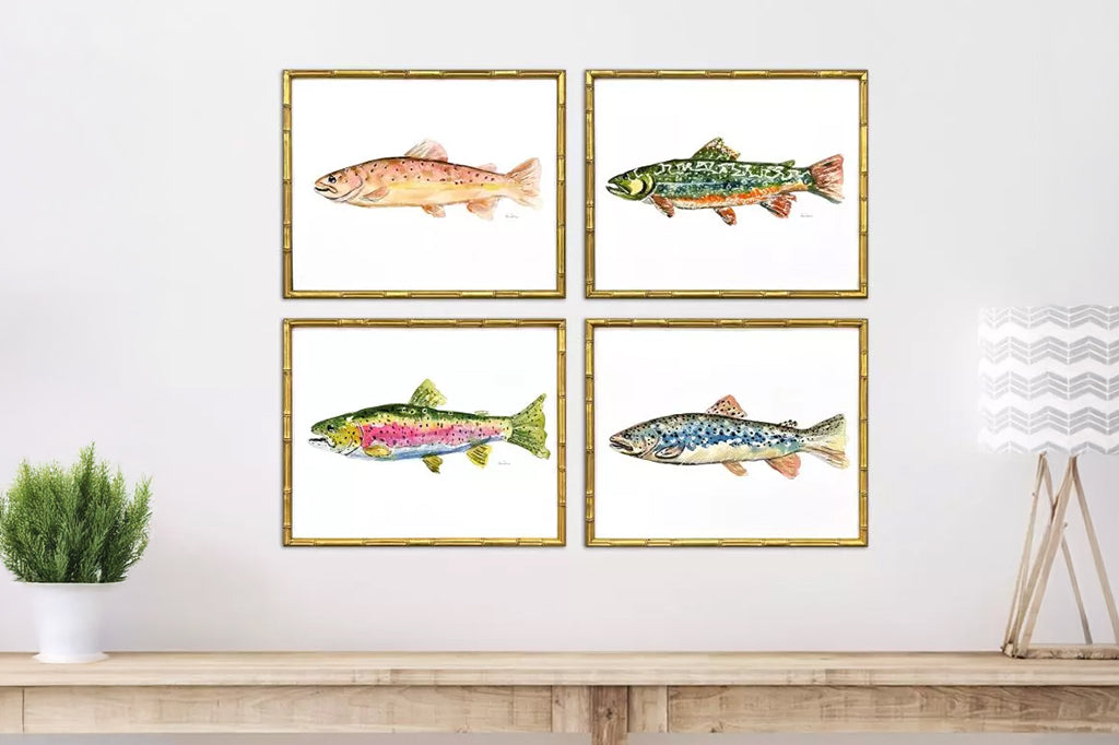 Set of four colorful trout in gold frame mounted on wall