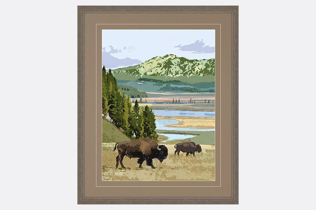 framed artwork of mountains, field and grazing buffalos