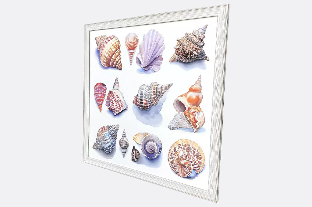 side angle view A coastal giclee features a variety of ocean seashells in varying colors. Framed to the image in a whitewash distressed wood with ribbed face.