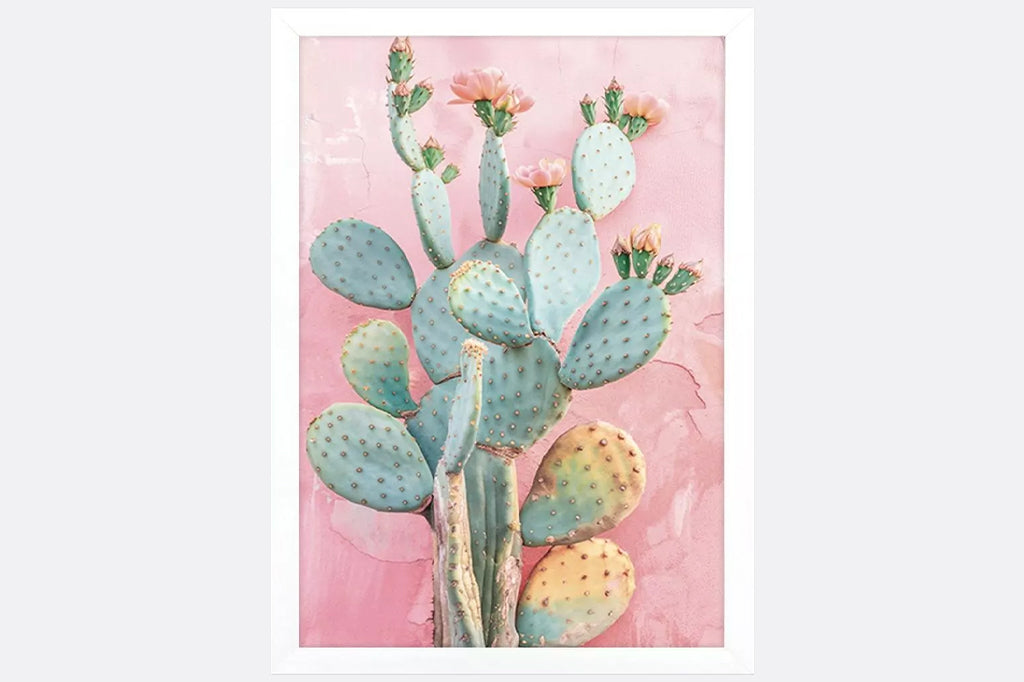 Flowering cactus botanical prints are framed to the image in a modern flat profile moulding in a white matte finish.
