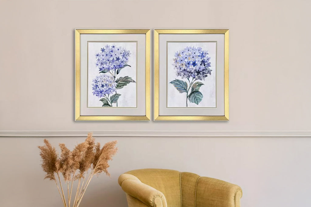 Hydrangea prints are double matted with a neutral top mat and pewter. Framed in a modern gold finish moulding with champagne side and lip. in room soon