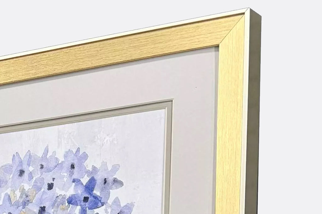 detailed view of golden frame around hydrangea prints