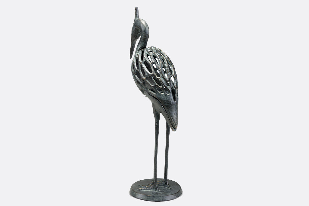 Modern metal heron candleholder face back