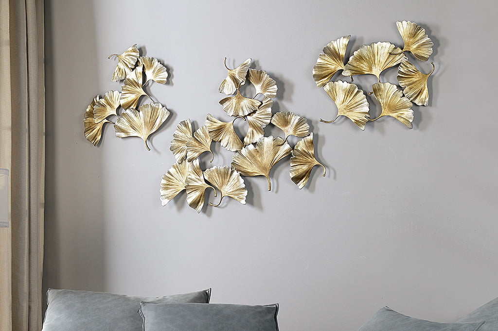 trio of ginkgo themed wall plaques in living room