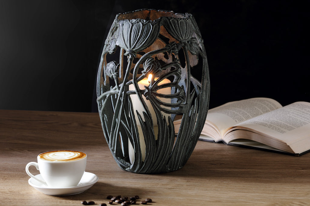 Garden Party Candleholder on table with a book and coffee