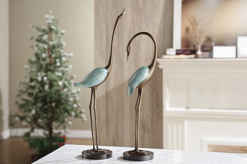 cast metal cranes in bronze and blue patina pair of two sculptures