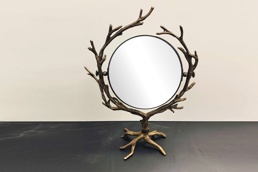 tree and branch theme for a two-sided vanity mirror